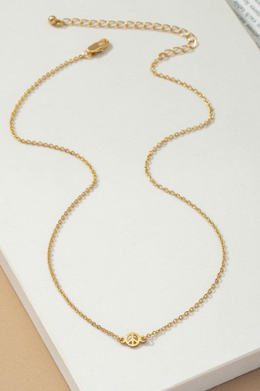 Delicate brass peace sign necklace